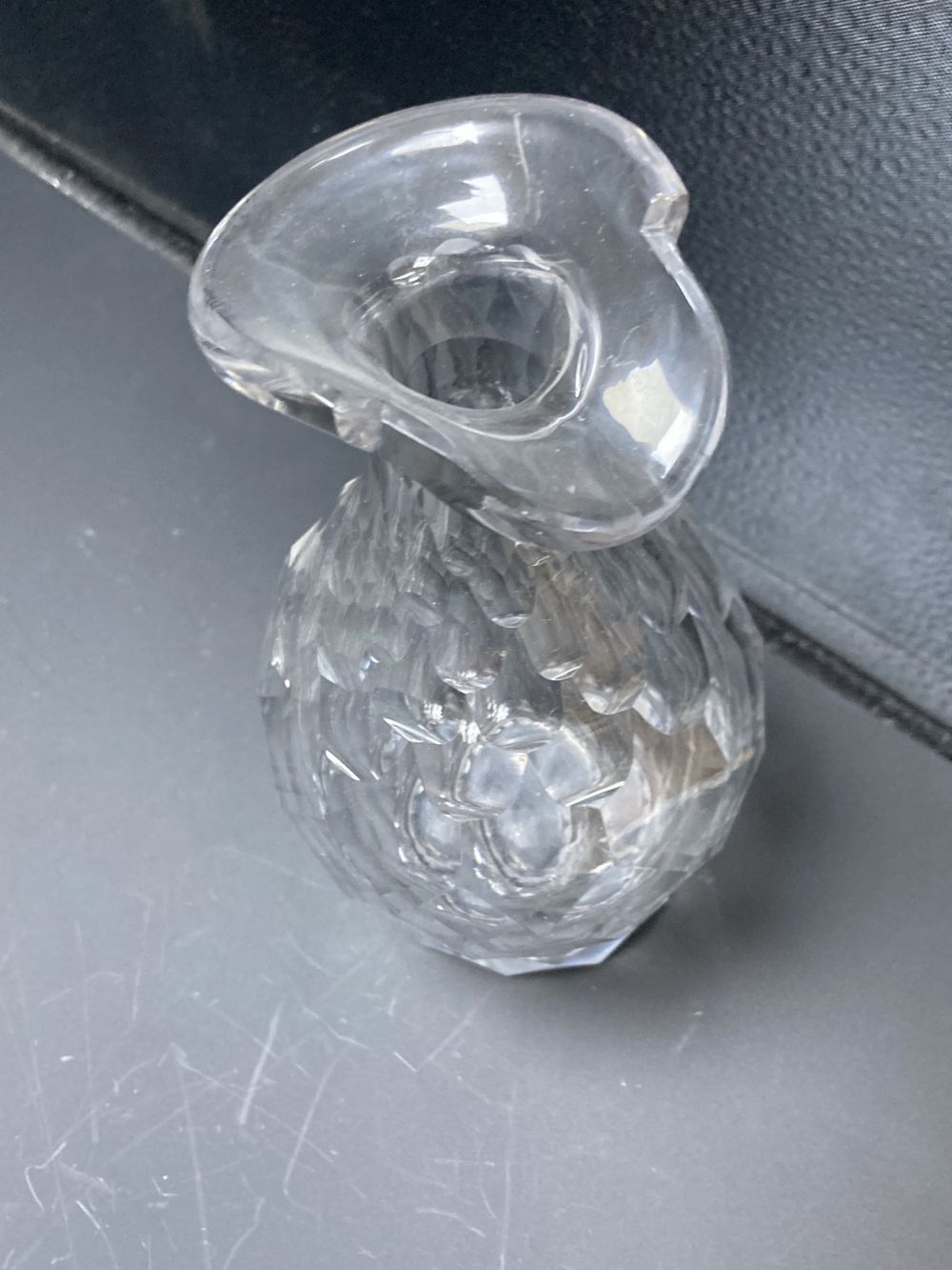 A set of three facet cut glass decanters and stoppers, early 19th century, 27.5cm